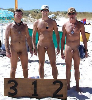 Three gay friends sunbathing on the beach naked